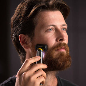 MicroTouch SOLO with three grooming combs and brush organized for versatile styling