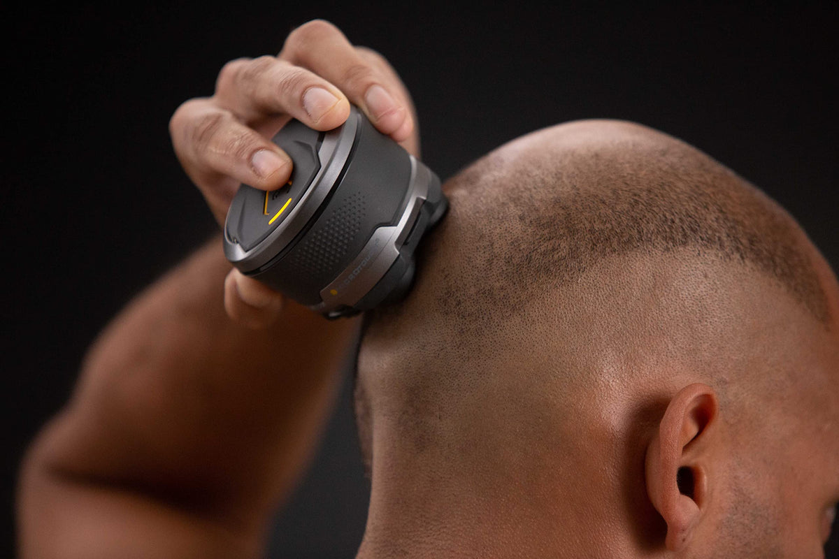 MicroTouch in use shaving a scalp to show fast, even results without nicks