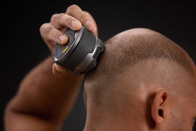 MicroTouch in use shaving a scalp to show fast, even results without nicks