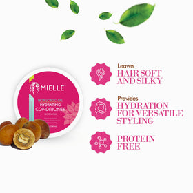 Mielle Organics conditioner being applied to hair reducing tangles