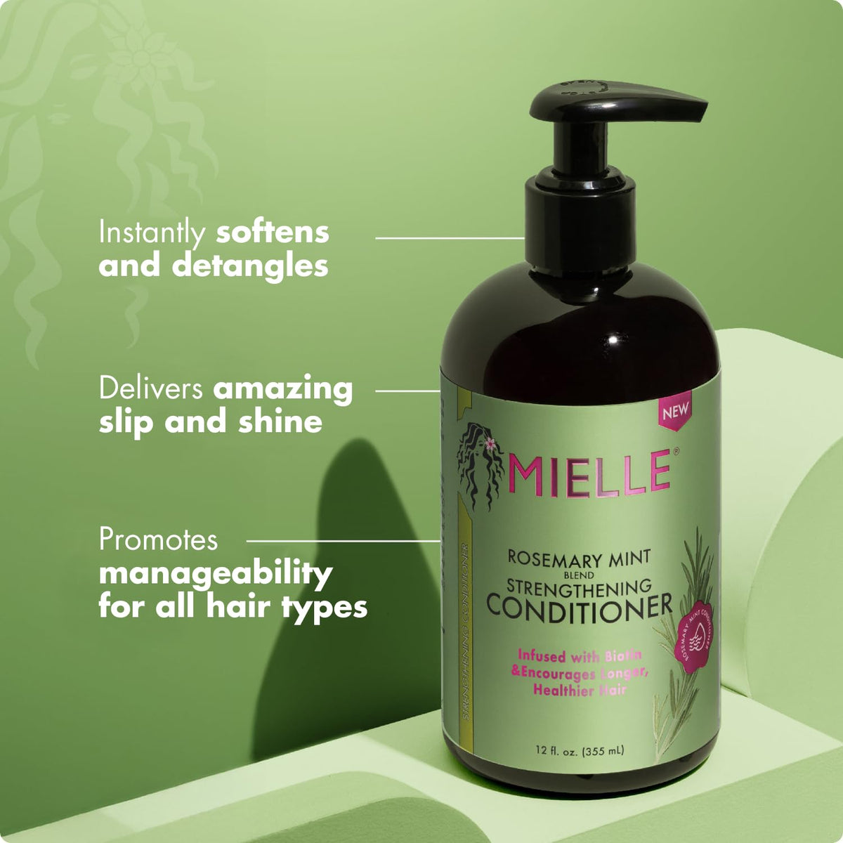 Mielle Organics conditioner applied to hair in hands demonstrating detangling benefit and smoothness