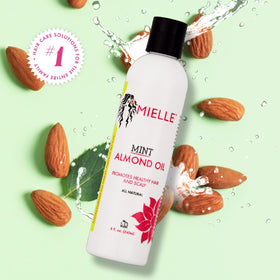 Mielle Organics mint almond oil in a bathroom setting showing daily routine use