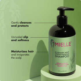 Mielle Organics label close-up highlighting rosemary mint and biotin benefits
