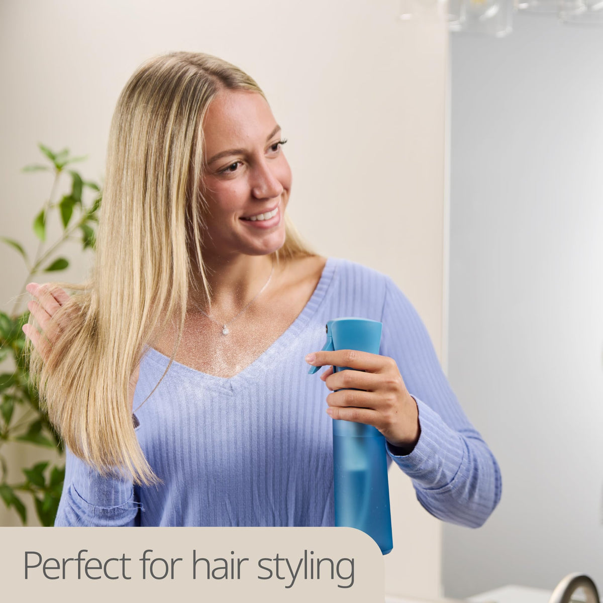 MIGHTY STRONG spraying fine mist on hair for quick styling refresh