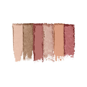 Milani palette next to coin illustrating compact size and handbag friendliness