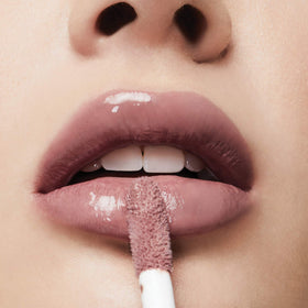 Milani open cap with visible gloss wand highlighting formula consistency