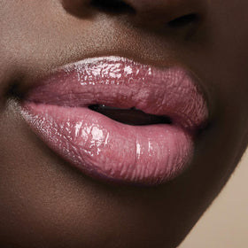 Milani lifestyle shot in hands with clutch showing portable touch-up convenience