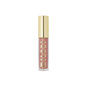 Milani gloss in hand portraying compact, travel-ready cosmetic benefit