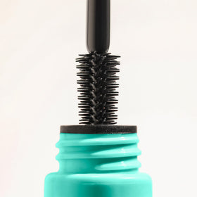 Milani mascara beside a ruler for scale and travel-friendly size