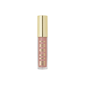 Milani prismatic peach on dressed model in lifestyle shot adding subtle polished sheen