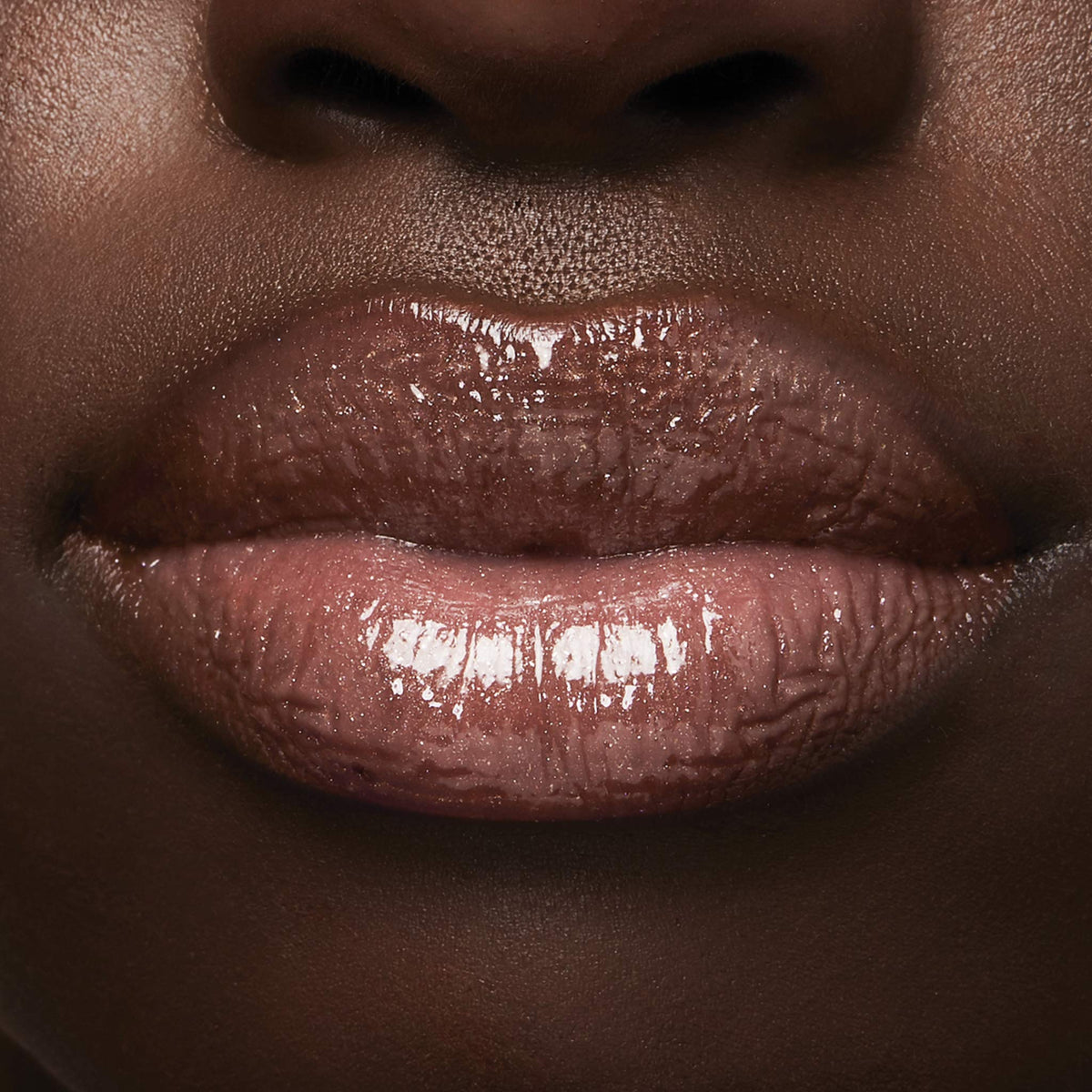 Milani prismatic peach open bottle label detail highlighting ingredients like hyaluronic acid