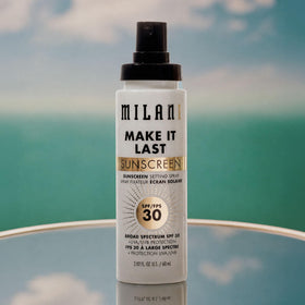 Milani setting spray in outdoor scene offering sun protection while on-the-go