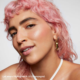 Milk Makeup bronzer swiped on collarbone and leg for all-over bronze glow