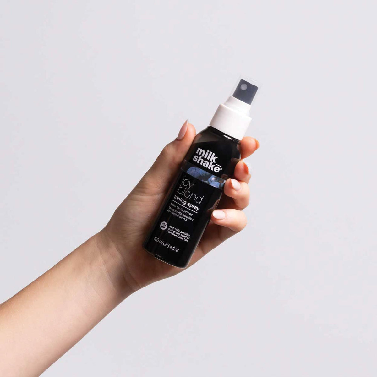 milk_shake finish on hair strands close-up, reveals added shine and smoothness