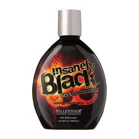Millennium Tanning bottle next to hand for scale showing 13.5oz size