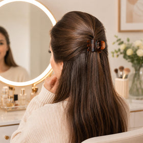 minihope half-up hairstyle held by clip showing quick styling and comfortable wear