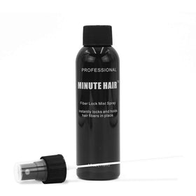 Minute Hair being applied to scalp to secure fibers and reduce shedding