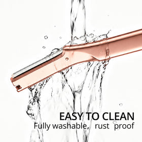 Mistfree razor beside a coin showing compact size and travel convenience