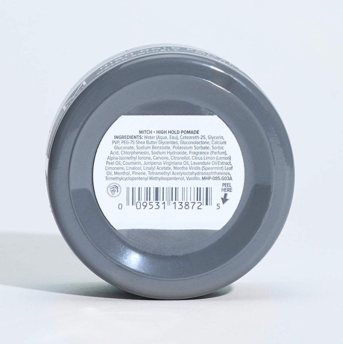 MITCH pomade 3 oz next to hand showing compact size and travel-friendly benefit