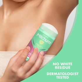 Model applying Mitchum underarm demonstrating discreet, non-sticky protection benefit