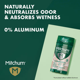 Applying Mitchum cedarwood deodorant in hand to show easy, non-greasy application