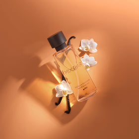 MIX:BAR next to a hand for size comparison showing the 5oz bottle benefit: travel-friendly