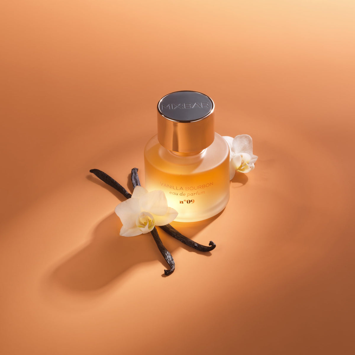 MIX:BAR bottle styled on vanity with candles implying cozy, warm fragrance atmosphere