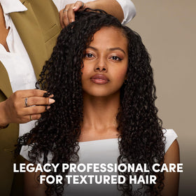 Mizani on bathroom vanity styled in routine for daily curl maintenance