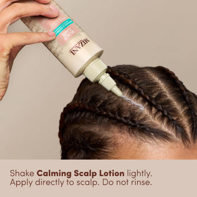 Mizani applying lotion to braided scalp demonstrating soothing relief