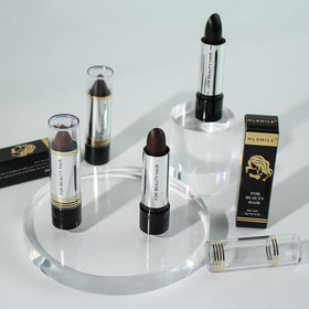 MLSMILE touch-up stick inside a purse illustrating portability and on-the-go fixes