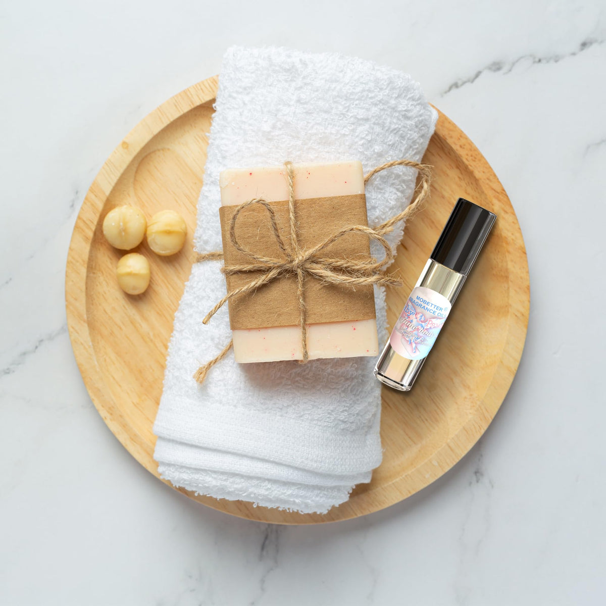 MOBETTER FRAGRANCE OILS held in hand to show travel-friendly size and convenience