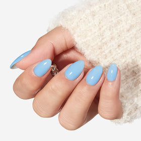modelones close-up of smooth blue oval nail surface highlighting glossy texture and durability