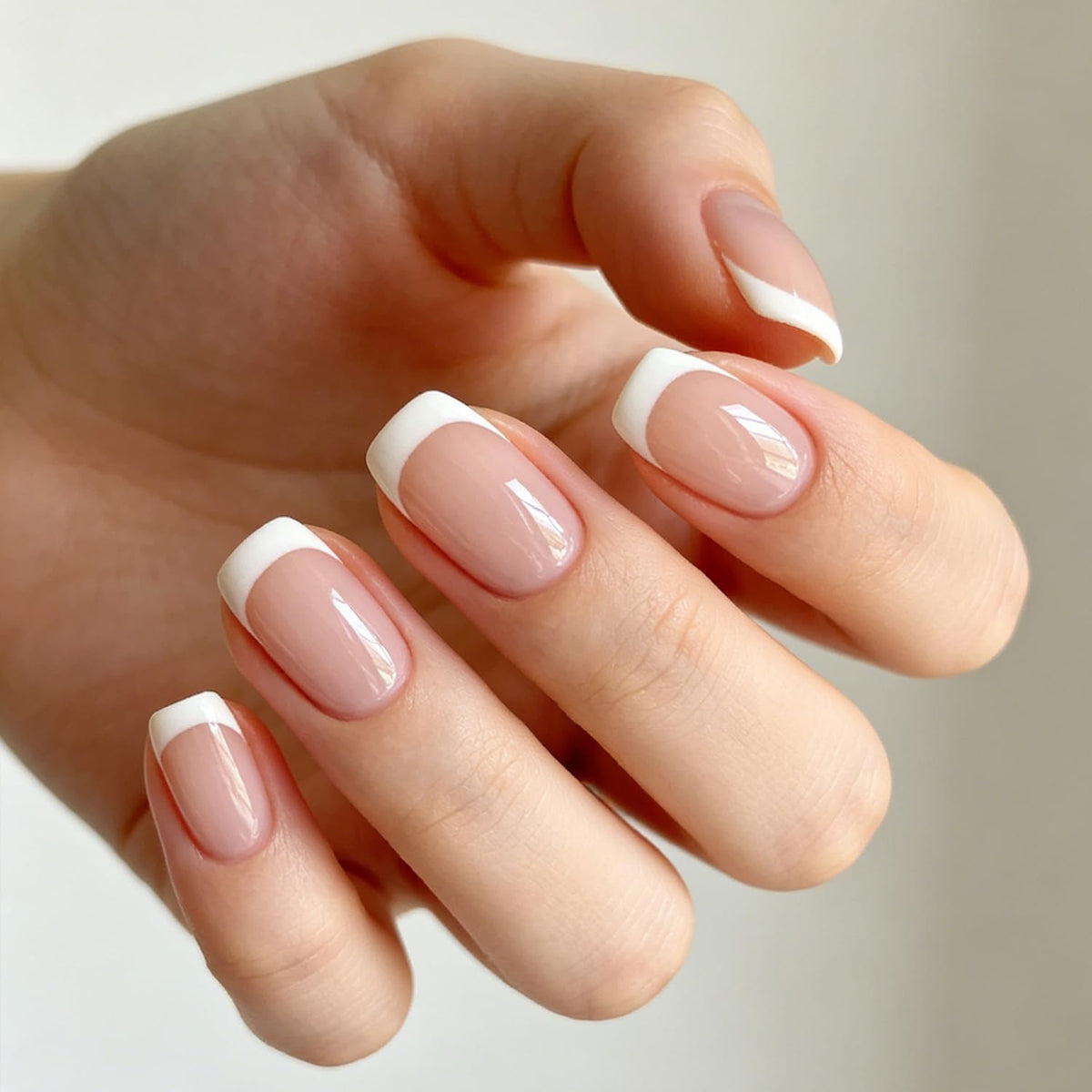 modelones close-up of pink and white French tips highlighting crisp finish