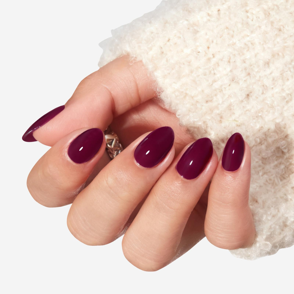 modelones close-up of glossy burgundy nail surface highlighting smooth finish and salon shine