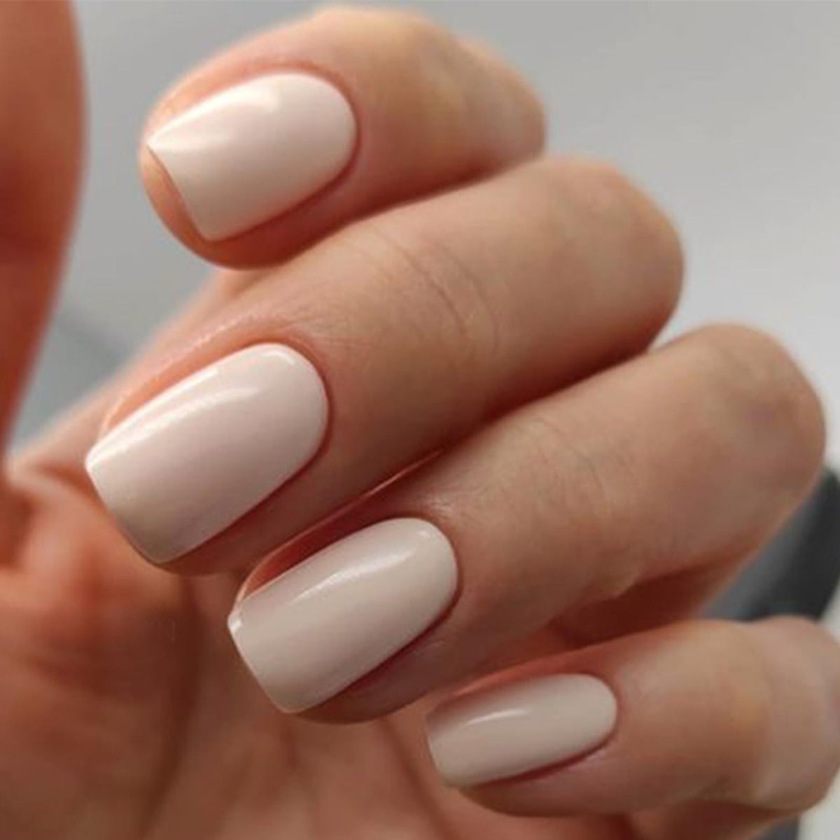 modelones close-up of white-pink finish highlighting glossy smooth look and polish-free benefit