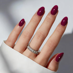 modelones front packaging showing burgundy oval press-on nails and included tools, clear contents benefit