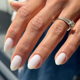 modelones front packaging showing milky white oval press-on nails and kit contents