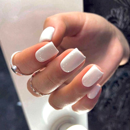 modelones front packaging showing the pure white press-on nails and full kit benefits