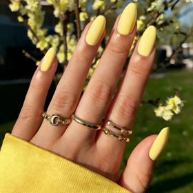 modelones front set showing 32 neon yellow nails and accessories for fast manicures