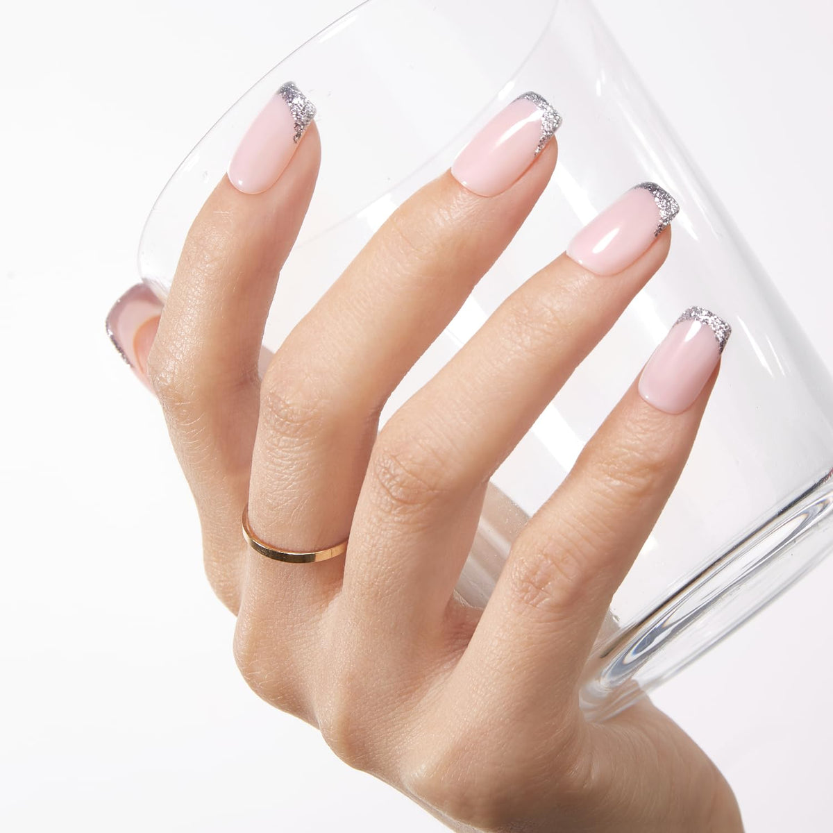 modelones hands in salon setting displaying natural-looking manicured nails