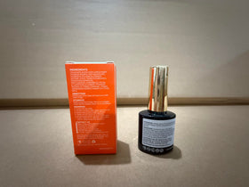 modelones bottle beside a coin to show compact size and travel-friendly benefit