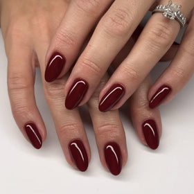 modelones close-up of short almond nails showing glossy finish and durable texture