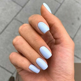 modelones close-up of short square baby blue nails highlighting smooth finish