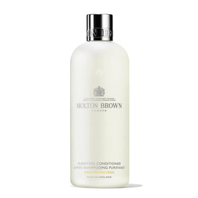 Molton Brown conditioner front packaging showing 10 fl. oz and elegant label for premium presentation