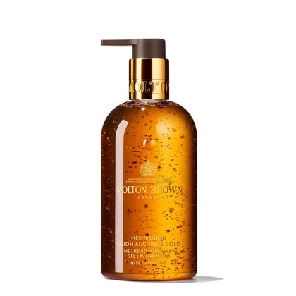 Molton Brown front bottle view showing Mesmerising Oudh Accord & Gold and elegant packaging benefit: instant luxury