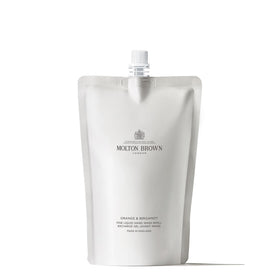 Molton Brown front packaging of Orange & Bergamot refill showing citrus branding and reduced plastic benefit