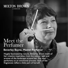 Molton Brown pump dispensing body wash in shower demonstrating controlled use