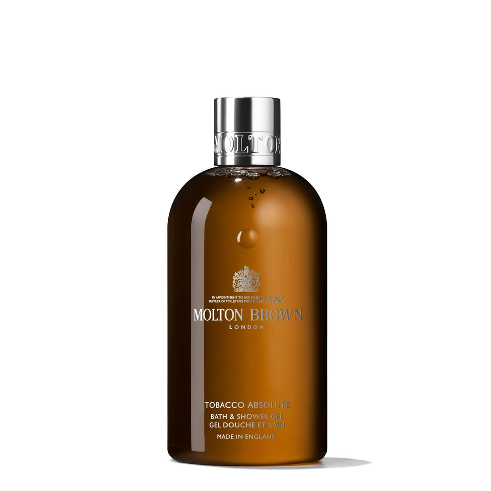 Molton Brown front bottle shot showing elegant label and woody fragrance
