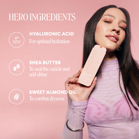 MONDAY HAIRCARE 5 oz bottle held in hand showing size and portability
