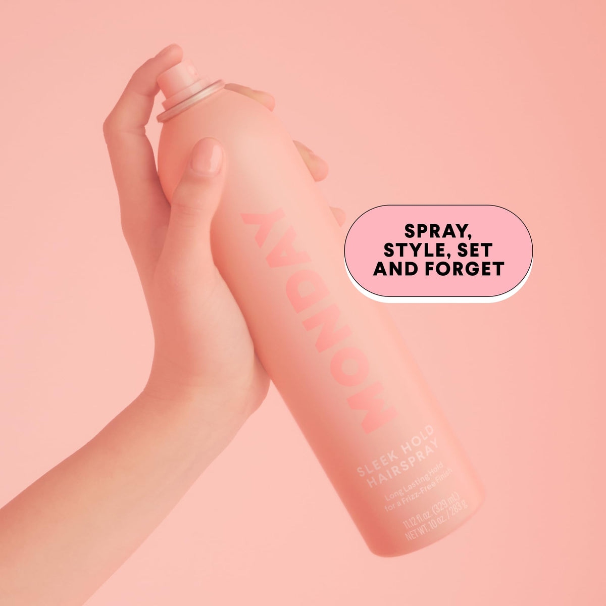 MONDAY HAIRCARE spray in use creating fine mist for even hold benefit